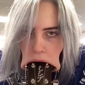 Billie Eilish sucking the guitar